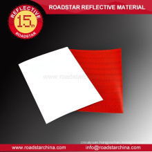 Highly visible colored reflective film material